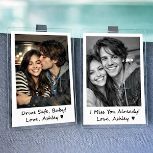 May include: Two clear photo holders with black and white photos of a couple. One photo has the text "Drive Safe, Baby! Love, Ashley". The other photo has the text "I Miss You Already! Love, Ashley".