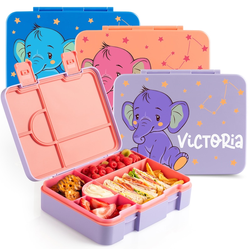 May include: A collection of colorful lunch boxes with elephant designs. One box is open, revealing compartments filled with food like sandwiches, fruit, and snacks. The boxes are blue, orange, pink, and purple, with star patterns and the name "Victoria" on one.