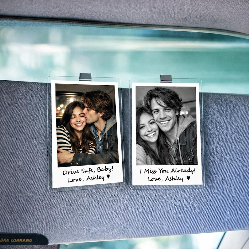 May include: Two clear photo holders with black and white photos of a couple. One photo has the text "Drive Safe, Baby! Love, Ashley". The other photo has the text "I Miss You Already! Love, Ashley".