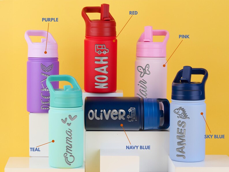 May include: Seven personalized water bottles in various colors, including purple, red, pink, teal, navy blue, and sky blue. Each bottle has a different name engraved on it, such as Noah, Oliver, and James. The bottles have a carrying handle and a straw lid.