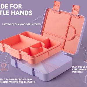 May include: A two-tone lunch box with a peach-colored interior and a lavender exterior. The lunch box has multiple compartments and easy-to-open latches. Text on the image reads "Made for Little Hands" and "Removable, Dishwasher-Safe Tray".