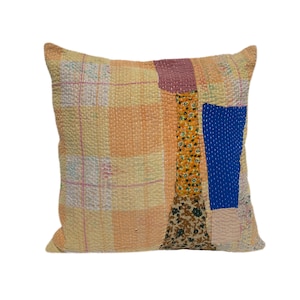 May include: A patchwork pillow cover with a light orange background and various colored fabric squares. The pillow cover is made of a soft, quilted fabric and features a variety of patterns, including floral, geometric, and plaid.
