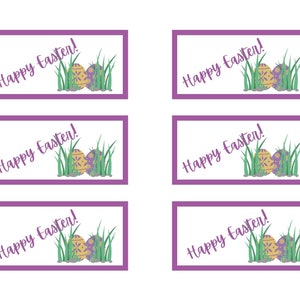 May include: Six printable gift tags with a purple border and the text "Happy Easter!" in a white font. Each tag features a pair of Easter eggs with a green, yellow, and purple pattern in a bed of green grass.