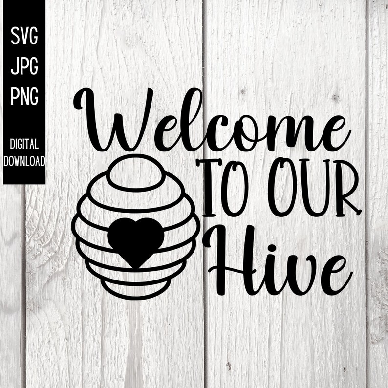May include: Black and white digital download design with the text "Welcome TO OUR Hive" and a beehive graphic with a heart. The design is on a white wooden background. Includes SVG, JPG, and PNG file formats.