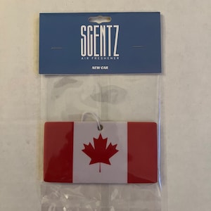 May include: A white car air freshener with a red and white Canadian flag design. The air freshener is packaged in a clear plastic bag with a blue header card that reads "Scentz Air Freshener New Car".