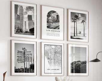 May include: A set of six framed black and white art prints. The prints depict cityscapes, maps, and palm trees. The text "LOS ANGELES" is visible on two prints. The bottom of the image reads "Set Of 6 Art Prints + Bonus".