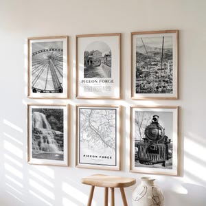 May include: Six framed black and white prints with wooden frames. The prints depict a Ferris wheel, a building with a waterfall, a city view, a waterfall, a map, and a train. The text "PIGEON FORGE" is visible on some prints.