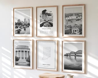 Puede incluir: Seis impresiones en blanco y negro enmarcadas de monumentos y paisajes urbanos de Indiana. Las impresiones se exhiben en una pared blanca con un taburete de madera y un jarrón decorativo al frente. Las impresiones incluyen la palabra "Indiana".
