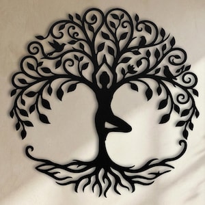 Black silhouette yoga woman, metal vrksasana wall hanging.