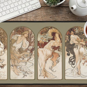 May include: A decorative mousepad featuring four panels with art nouveau style illustrations of women representing the four seasons. Each panel has a different color scheme and features a woman with flowing hair and a floral design. The panels are separated by a thin, light green border.
