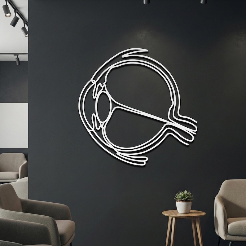 White medical science line art on dark wall showing cross-section of cornea, lens, and optic nerve.