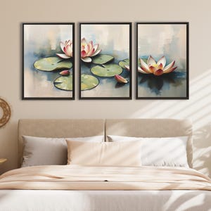May include: Triptych canvas art featuring watercolor paintings of water lilies. Each framed panel displays a lily pad with a pink and white flower. The background is a soft blend of blues and whites, creating a serene and natural scene.