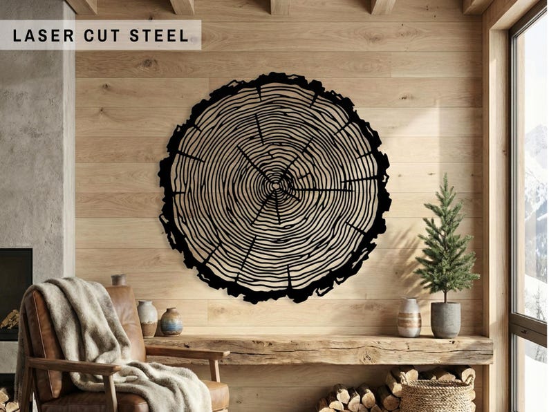 Black metal tree ring wall art, wood slice sign on light wood cabin wall