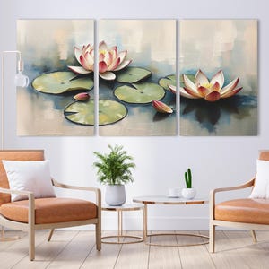 May include: Triptych canvas art featuring a serene water lily pond scene. The artwork showcases three panels with soft, impressionistic brushstrokes. Pink and white water lilies float on the water, surrounded by green lily pads. The overall color palette is muted.