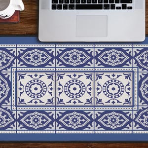 May include: Blue and white patterned mouse pad with a geometric design. The mouse pad is on a wooden surface with a laptop and a coffee cup.