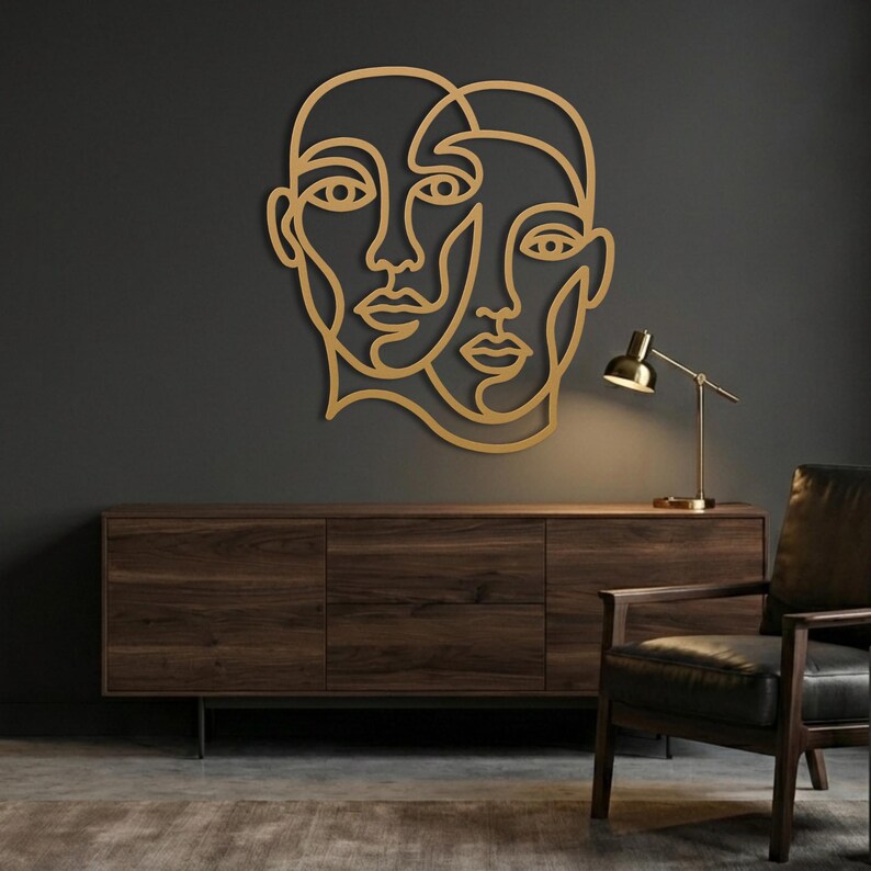 Gold picasso style wall decor, modern metal face art for living room.