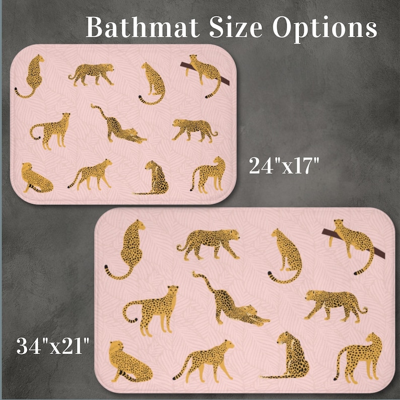 May include: Two bath mats with a pink background and a cheetah print pattern. The smaller bath mat is 24 inches by 17 inches. The larger bath mat is 34 inches by 21 inches. Both bath mats feature a cheetah print pattern with gold cheetahs.