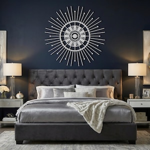 Silver geometric sun metal sign, large hollywood regency over bed decor above tufted headboard.