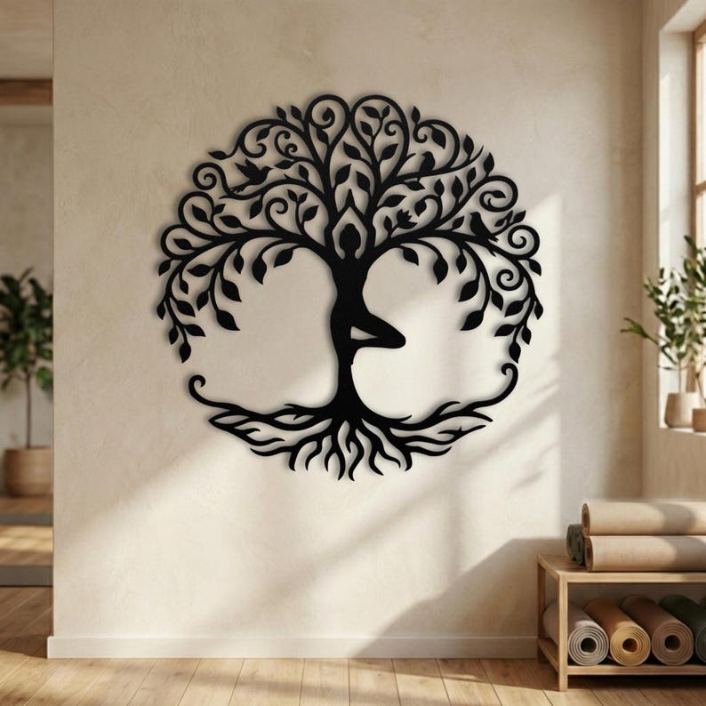 Black silhouette yoga woman, metal vrksasana wall hanging.