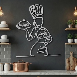 Silver metal female chef wall art with personalized "Carol's Kitchen" text on apron and "Bon Appetit" on platter.