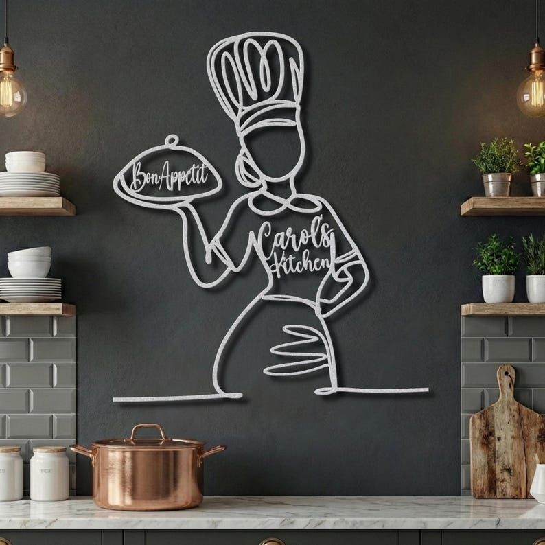 Silver metal female chef wall art with personalized "Carol's Kitchen" text on apron and "Bon Appetit" on platter.