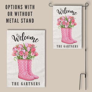 May include: Welcome garden flag with pink rain boots and a bouquet of pink tulips. The text "Welcome" and "The Gartners" is printed on the flag.