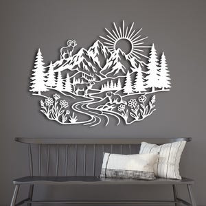 White laser cut steel scene of Rocky Mountains and wildlife on wood wall