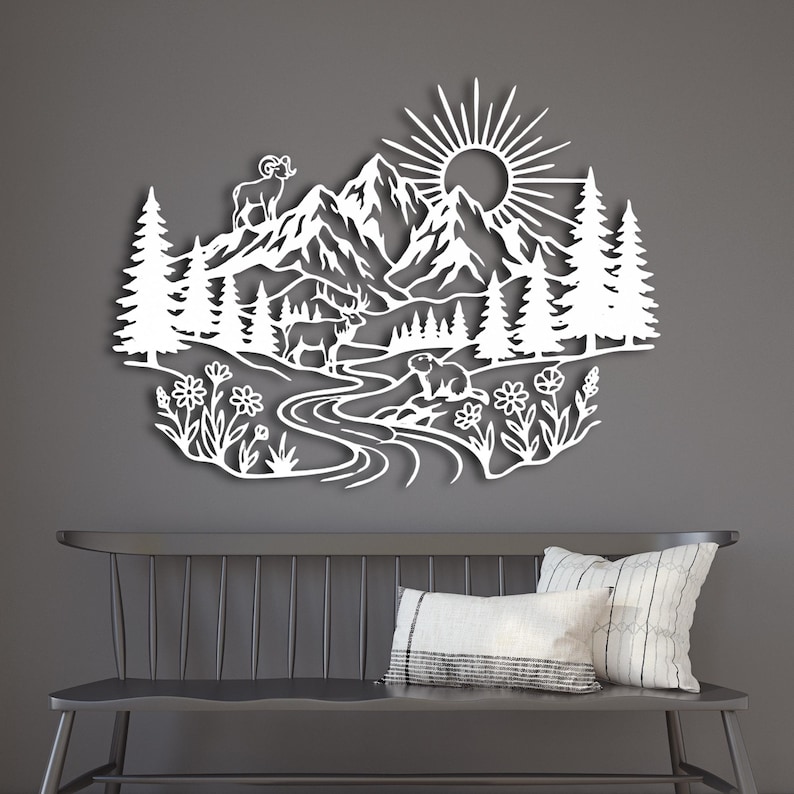 White laser cut steel scene of Rocky Mountains and wildlife on wood wall