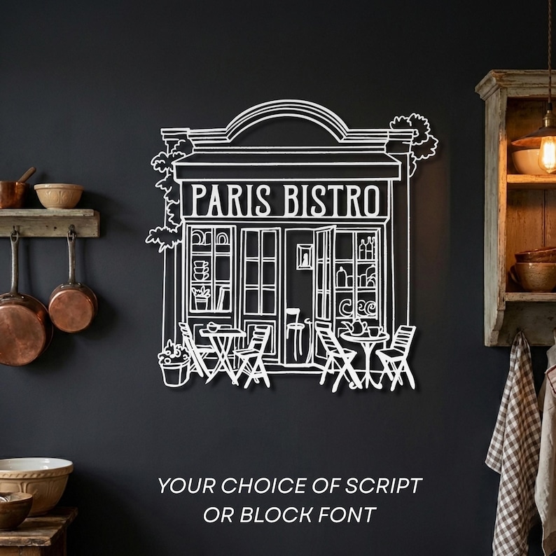White metal French bistro wall art with "Paris Bistro" in modern block font contrasting against a black wall.
