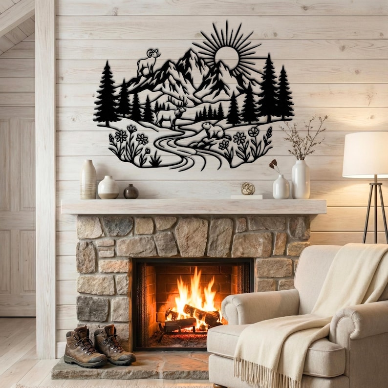 Black metal Rocky Mountain National Park art with elk, bighorn sheep, and marmot, displayed above stone fireplace.