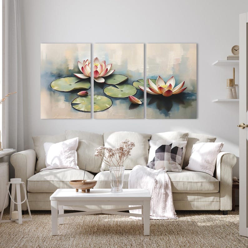 May include: A triptych canvas art print featuring a serene water lily pond scene. The artwork depicts pink and yellow water lilies with green lily pads floating on the water. The background has soft blue and beige tones, creating a calming atmosphere.