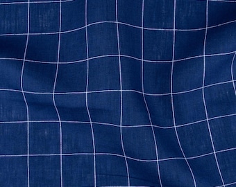 May include: Close-up of a navy blue fabric with a white grid pattern. The fabric has a slightly textured appearance, with soft folds and subtle variations in color. The grid lines are evenly spaced, creating a clean and modern design.