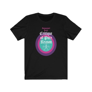 May include: Black t-shirt with a graphic design featuring a circle with concentric rings in pink, purple, and teal. The text "Immanuel Kant" and "Critique of Pure Reason" is printed in white gothic font.