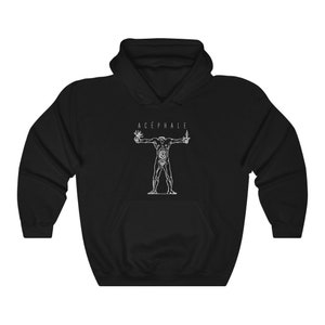 May include: Black hooded sweatshirt with a white graphic of a headless human figure with internal organs visible. The text "ACÉPHALE" is above the figure.