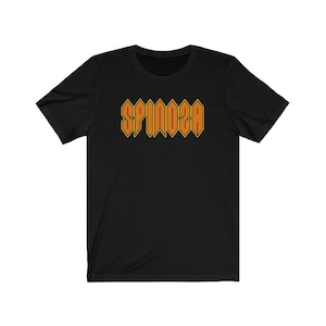 May include: Black t-shirt with an orange graphic of the word "SPINOZA" in a bold, blocky font.