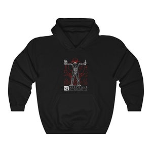 May include: Black hooded sweatshirt with a white illustration of a headless human figure with outstretched arms. The illustration is surrounded by red and white details. The text "ACEPHALE" and "DIONYSOS" is printed below the figure.