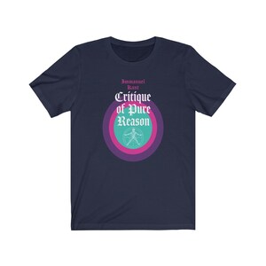 May include: Navy blue t-shirt with a graphic of a circle with concentric rings in pink, purple, and teal. The text "Immanuel Kant Critique of Pure Reason" is printed in white on the circle.