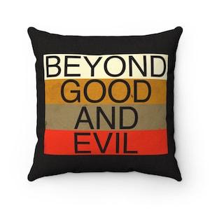 May include: Black throw pillow with the text "BEYOND GOOD AND EVIL" in white letters on a multi-colored striped background.