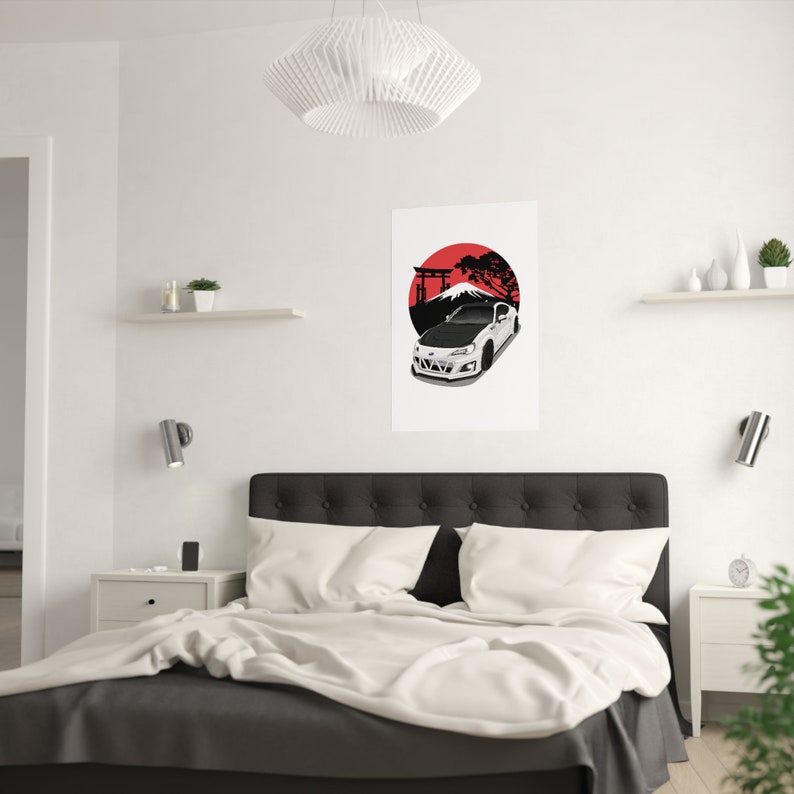Modern bedroom with a minimalist design featuring a custom car art poster of a white sports car set against a red and black Japanese-inspired backdrop, mounted on a clean white wall above a cozy bed