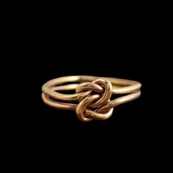 Knot ring connected made of brass movable