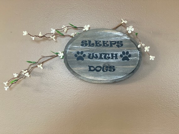 Sleeps with dogs  wall decor