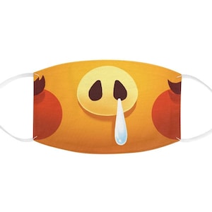 May include: A yellow face mask with a cartoon pig snout and red cheeks. The pig is crying a single teardrop.