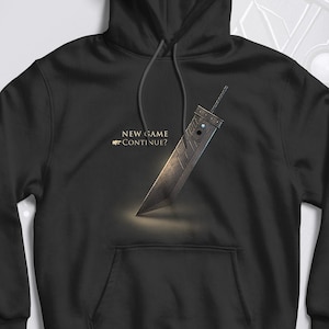 May include: Black hooded sweatshirt with a graphic of a large sword and the text "NEW GAME CONTINUE?" printed on the front.