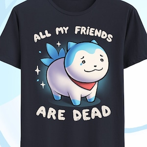 May include: A navy blue t-shirt with a cartoon dog wearing a red bandana. The dog has blue eyes and a sad expression. The text "All my friends are dead" is printed on the shirt.