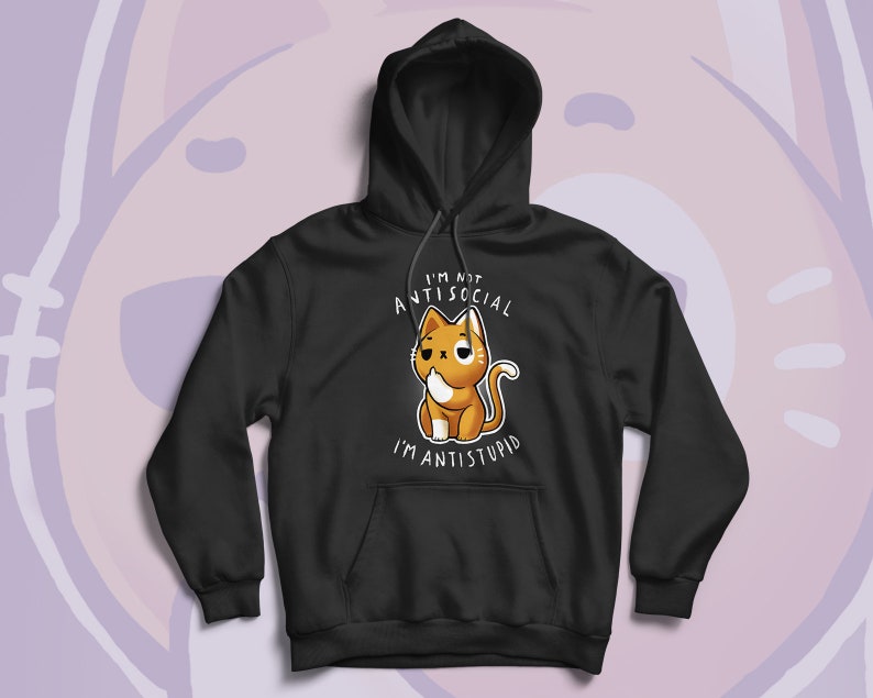 May include: Black hoodie featuring a cartoon cat with the text "I'M NOT ANTISOCIAL I'M ANTISTUPID". The cat is orange and white with a slightly grumpy expression. The hoodie has a drawstring hood and a front pocket.