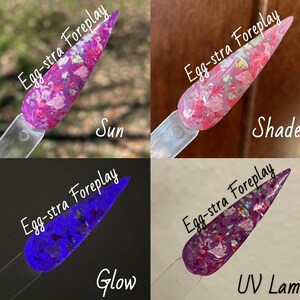 May include: Four nail polish bottles with a pink and purple glitter polish. The bottles are labeled "Egg-stra Foreplay" and have different captions: "Sun", "Shade", "Glow", and "UV Lamp".