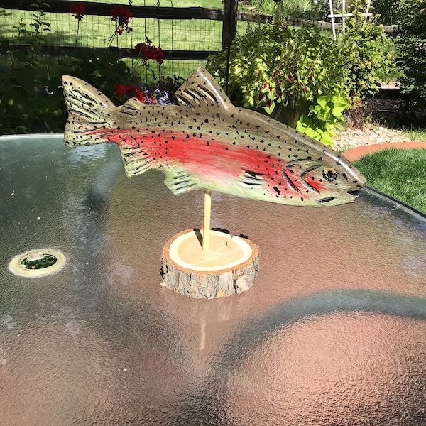 Trout Carvings: Rainbow, Cutthroat, Brown, or Brook Trout.  Wood carved, finished on both sides, have glass eyes, on a wood pedestal mount.