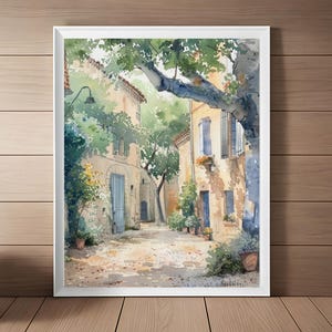 May include: Watercolor painting of a narrow street in a European village. The street is lined with stone buildings, and there are trees and plants growing along the sides. The buildings are painted in shades of yellow and brown, and the street is paved with cobblestones.