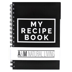 May include: Black spiral bound notebook with white text that reads "MY RECIPE BOOK" and a white label that reads "A&M NATURAL LIVING".