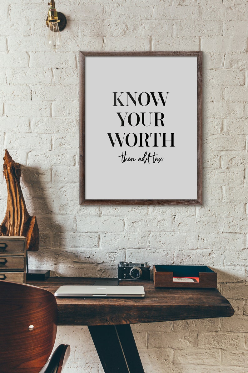 May include: A framed motivational poster with the text "KNOW YOUR WORTH then add tax" in black text on a white background.